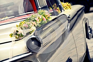 Old American limousine decorated as a wedding car