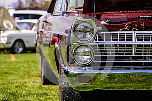 Old American muscle car half front side