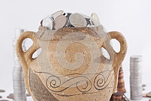 Old amphora with coins