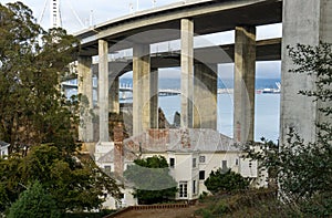 Old Anachronistic House Beneath Overpass