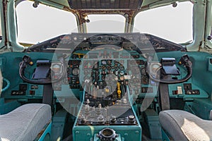 Old analog cockpit of an airliner airplane