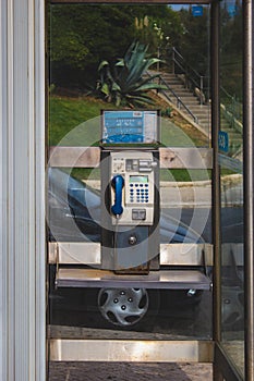 Old analog coin phone booth in Oeiras, Portugal