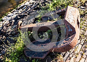Old anchor on sea coast, large rusty heavy anchor