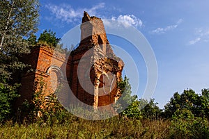 Old ancient abandoned church ruins overgrown by plants
