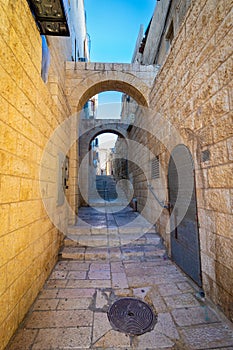 An old and ancient alley paved with stone tiles,