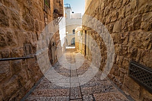 An old and ancient alley paved with stone tiles,