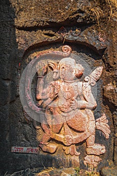 Old ancient carving of a Monkey Like Figure carved inside stone on indian fort