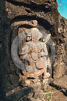 Old ancient carving of a Monkey Like Figure carved inside stone on indian fort