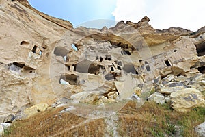 Old ancient cave temple on the top of a hill in the mountain valley of Cappadocia