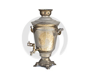 Old ancient chrome samovar contaminated with soot and grease, on a white isolated background