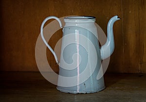 The old and ancient kettle on a table