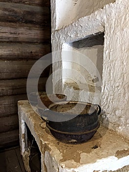 An old ancient kitchen with iron cauldrons