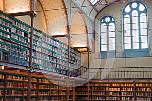 Old ancient library interior, ceiling books, windows, bookshelf