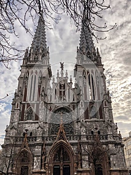 Old ancient medieval gray creepy scary catholic, orthodox Gothic church with spiers. European architecture