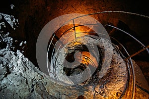 Old ancient spiral staircase in the well Tik Kuyu, in Chufut Kale, Bakhchisaray, Crimea Bakhchisarai Crimea photo