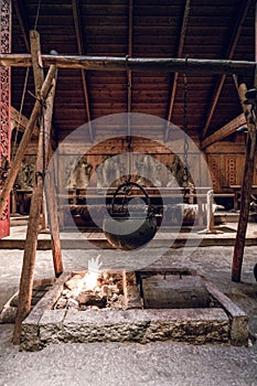Old ancient viking warrior home by the fireplace and the stew pot.
