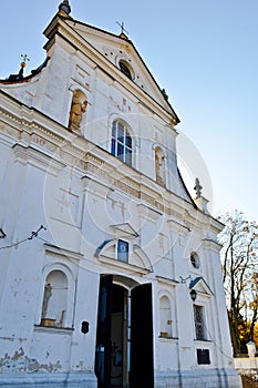 Old ancient white poor stone shabby Christian Orthodox church with crosses