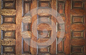 Old ancient wooden door in Spain. Selective focus