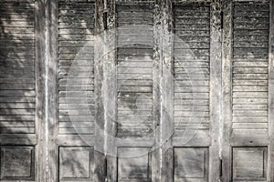 Old ancient wooden swing door background. Vintage of old wooden