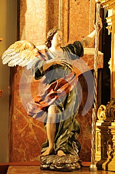 Old Angel sculpture carved in wood in Murcia