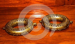 Old anklets in museum at the thanjavur maratha palace complex photo