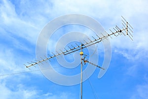 Old antenna with blue sky background