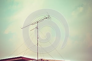 Old antenna with blue sky background. Silhouetted image