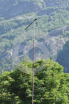 Old antenna on tall pole