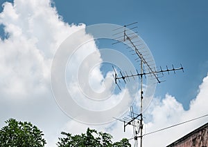 Old antenna for television with blue sky