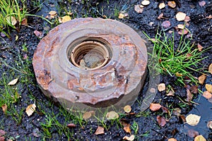 An old anti-personnel mine on the ground