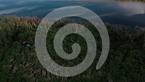 Old antic vintage wooden boat abandoned among tall reed grass outside Ukraine 4k aerial top view