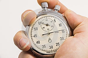 Old antiquary timer clock and humans hand photo