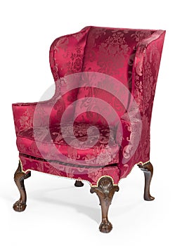 Old antique carved red upholstered wing arm chair photo