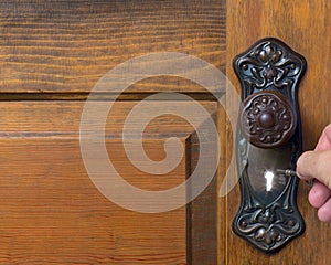 Old antique door with person trying out the skelet