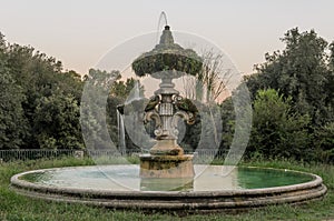 Old antique fountain at Villa Pamphili in Rome, Italy