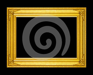 Old antique gold frame isolated on a black background.