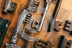 Old antique keys on a chessboard