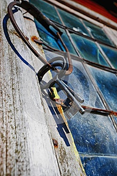 Old antique keys and ring against leaded window