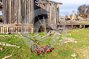 Old antique lawn mower in an abandoned western ghost town near Knab Utah photo