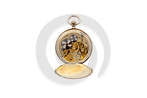 Old antique mechanical golden steel pocket watch with open lid isolated on white background.