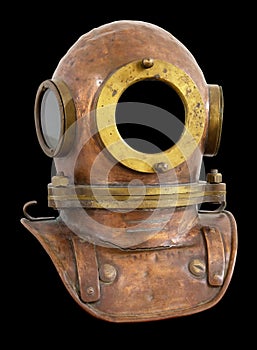 Old antique metal scuba helmet isolated on black background with clipping path