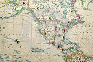 Antique map of America and destination marker pins