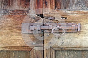 old antique rusty latch on a wooden door