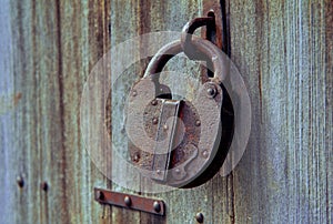 Old Antique rusty vintage lock on weathered wood Kalyan