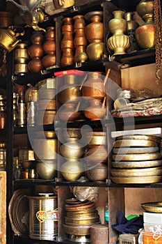 Old antique vessels stacked up in a shop, Maharashtra, India