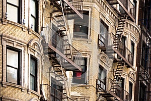 Old apartment building with fire escapes, Manhattan
