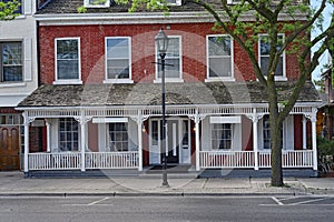 Old  apartment building or hotel with full width porch