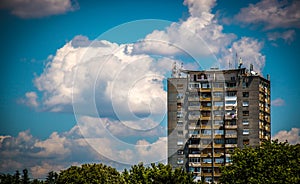 Old apartment building under blue sky with clouds in east Europe