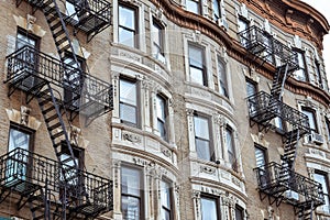 Old apartment facades, with fire stairs. Soho, Manhattan. NYC