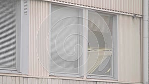 Old Apartment window with broken blinds, Low income neighborhood scene, Close Up